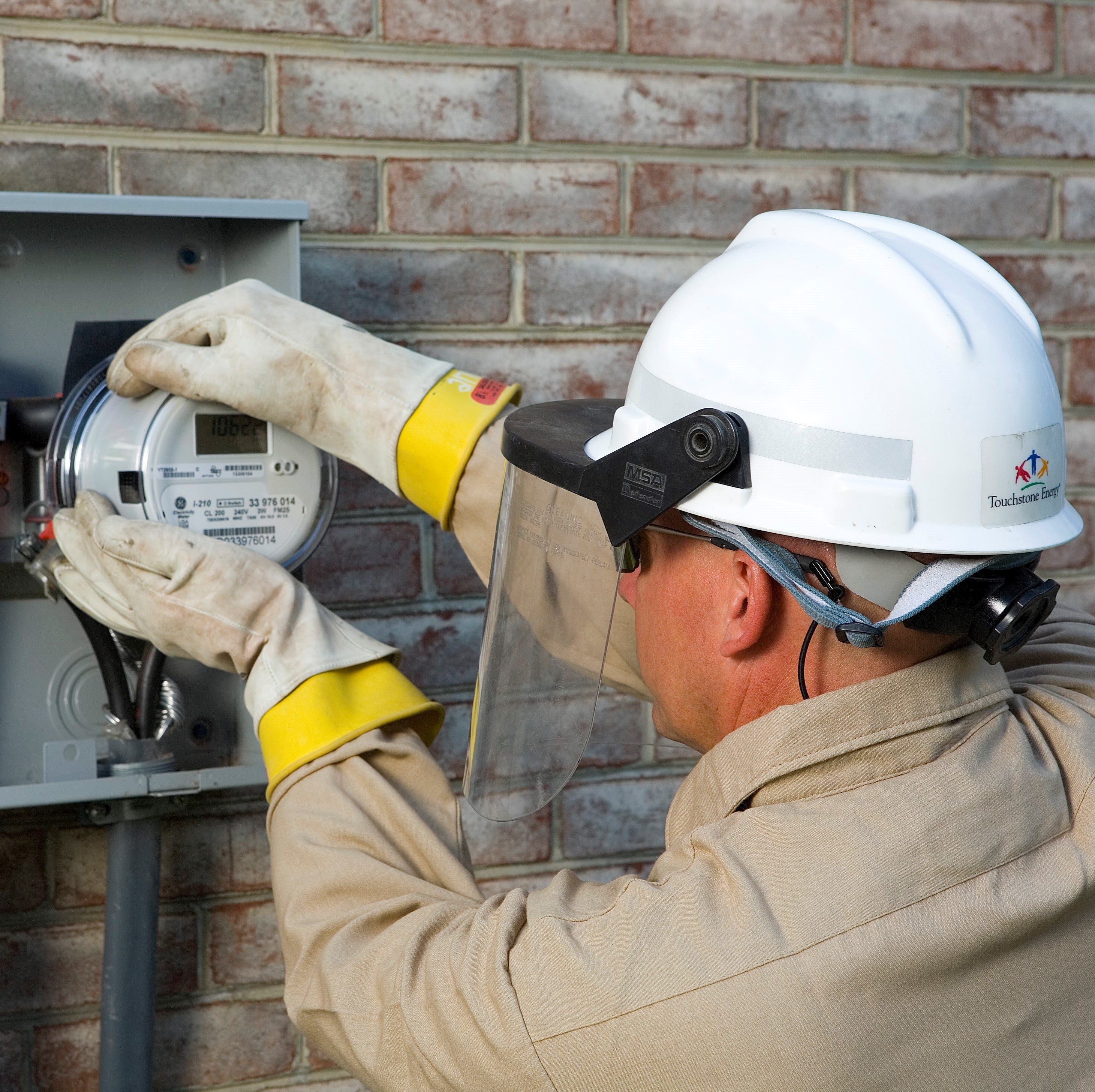 Photo of employee working on a meter. 