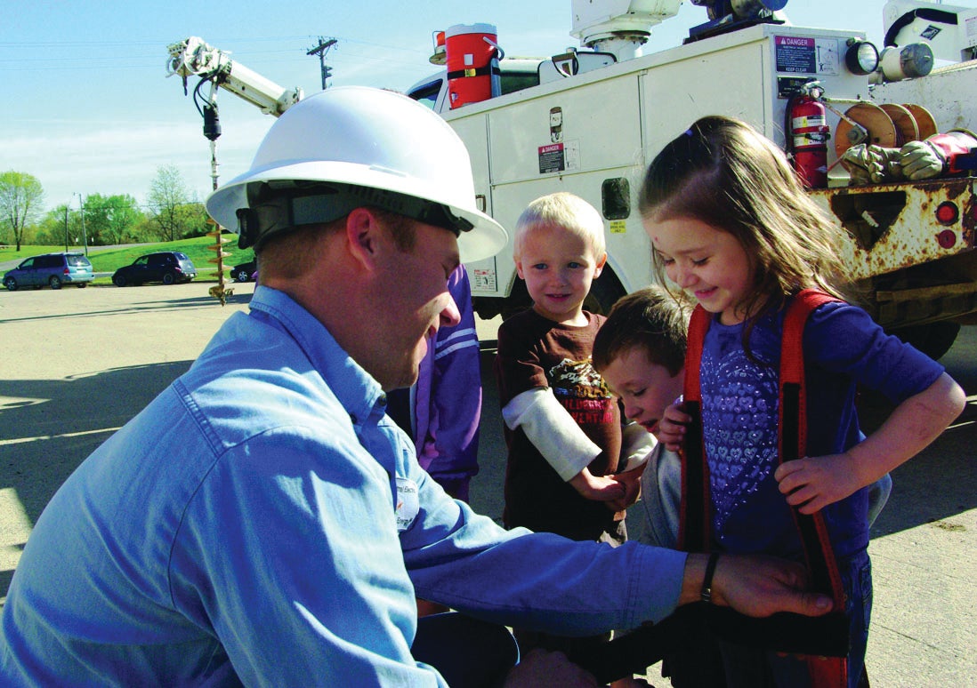 image of lineman with kids